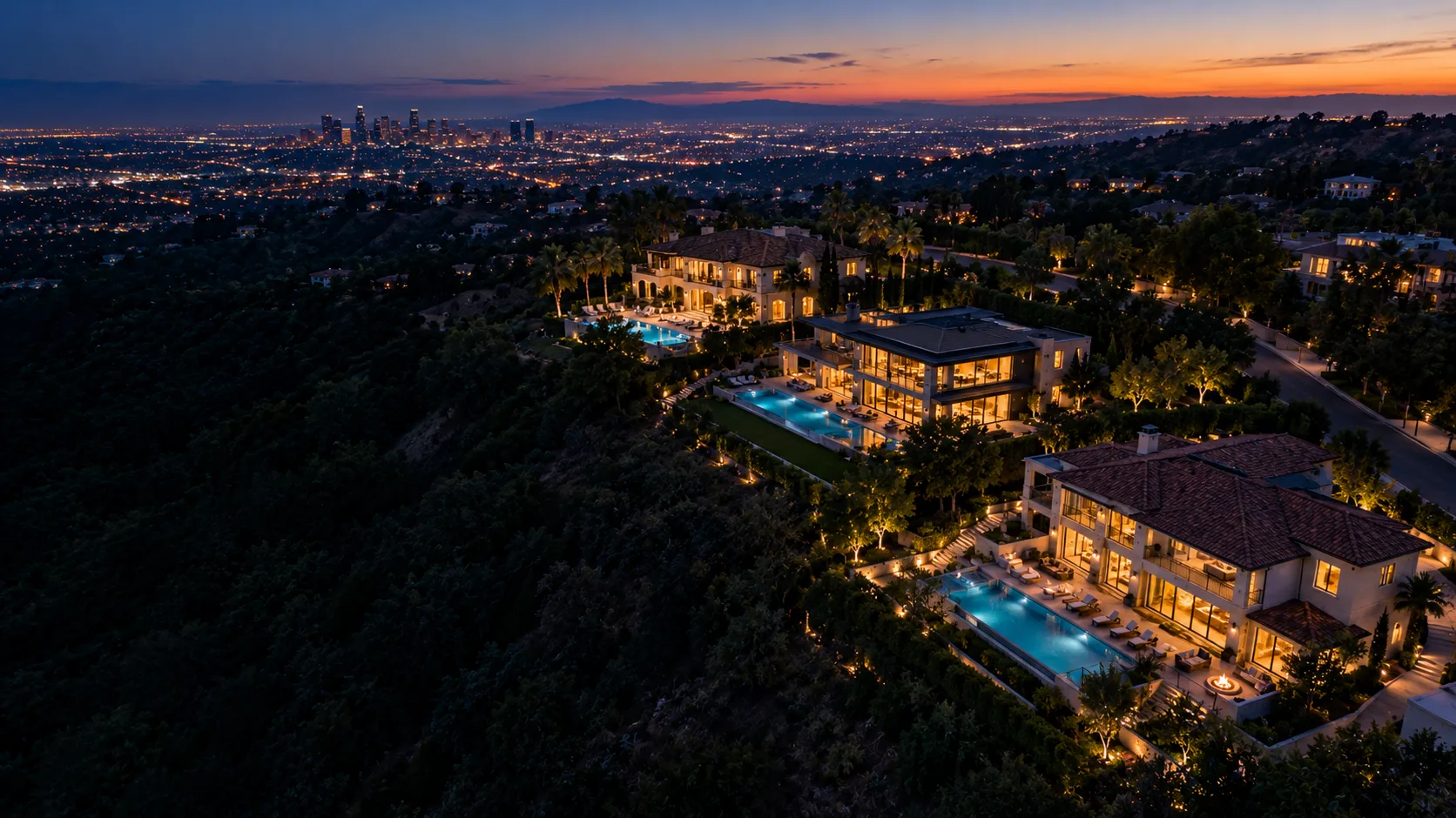 Aerial view of several homes on a hillside at dusk