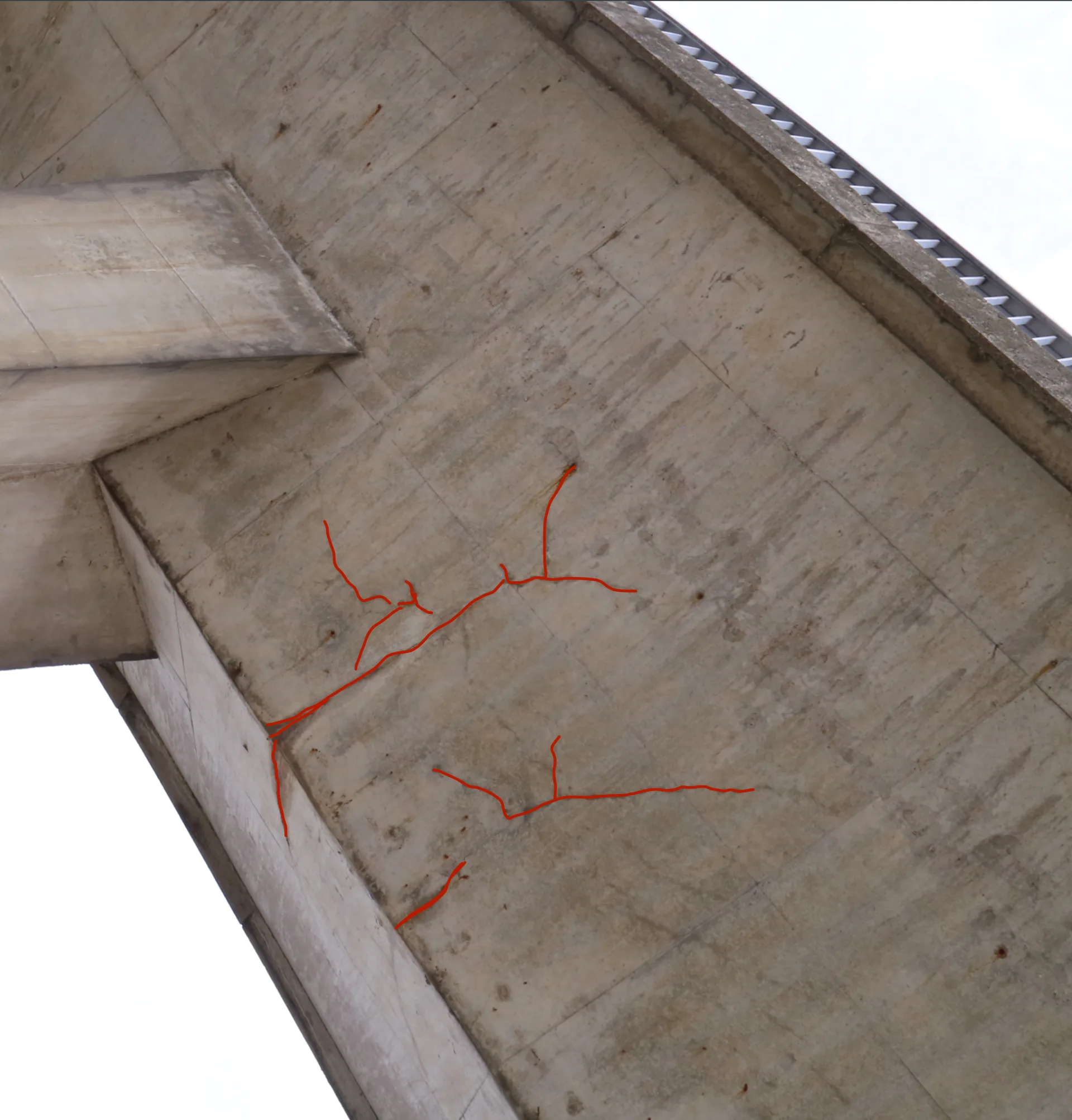 Detected cracks highlighted on a bridge pier